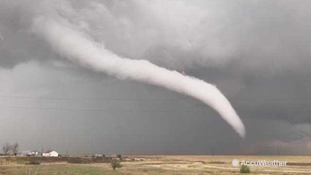 While tracking storms through Colorado Reed Timmer caught this tornado touching down in Keenesburg, Colorado.